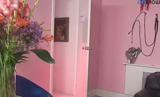 Brunette teases blondes nipples with red gloves